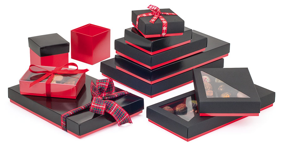 Display-of-scarlet-red-packaging-of-different-sizes-and-shapes-containing-an-array-of-chocolates-decorated-with-ribbons